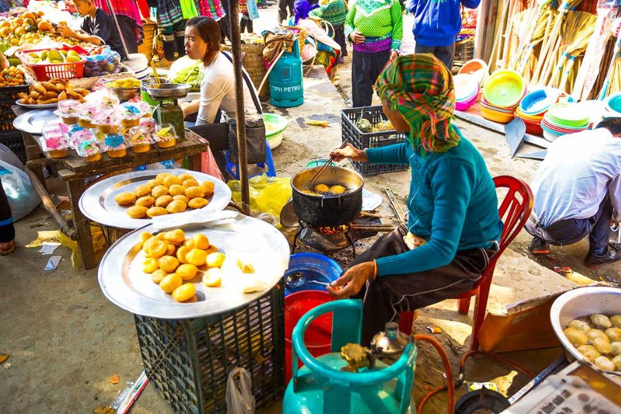 Try out sample local foods at Muong Hum Market