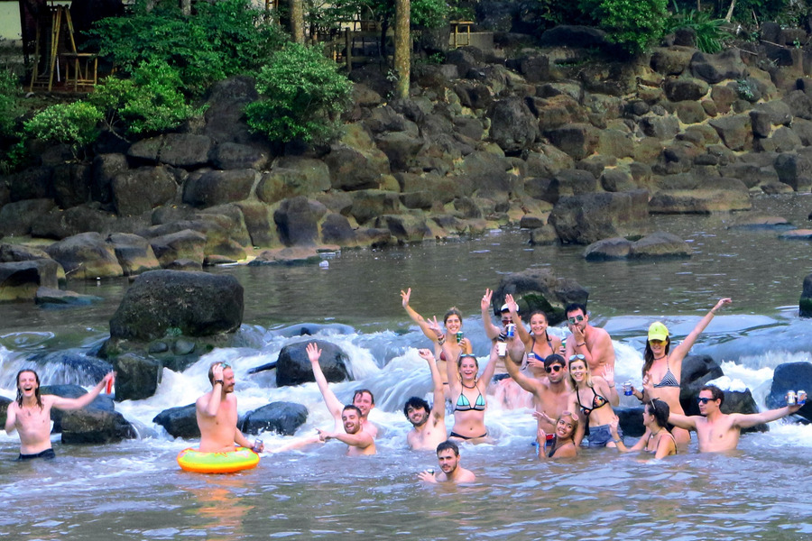 Immerse yourself in the cool, refreshing water at the base of the waterfall