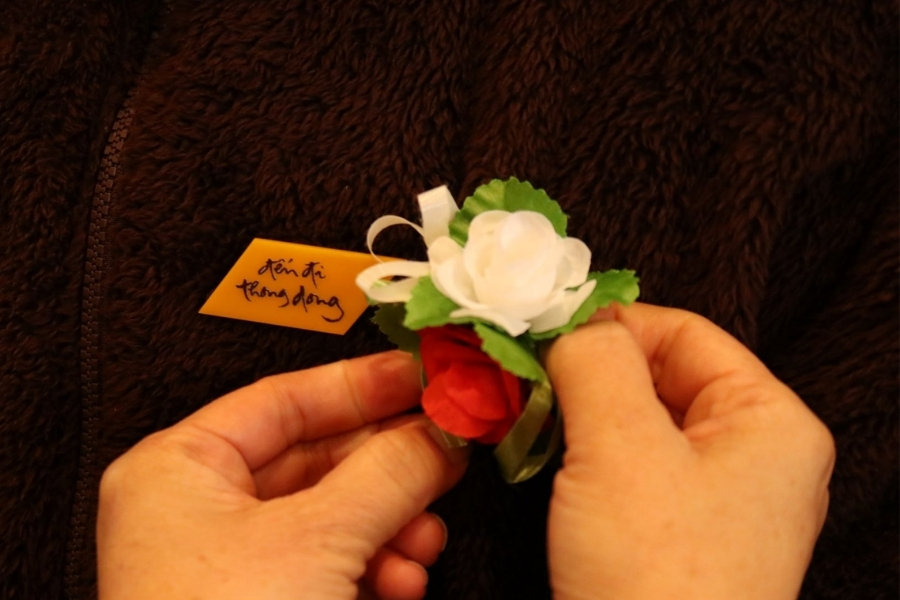 People usually pin a rose on their chest when going to the temple