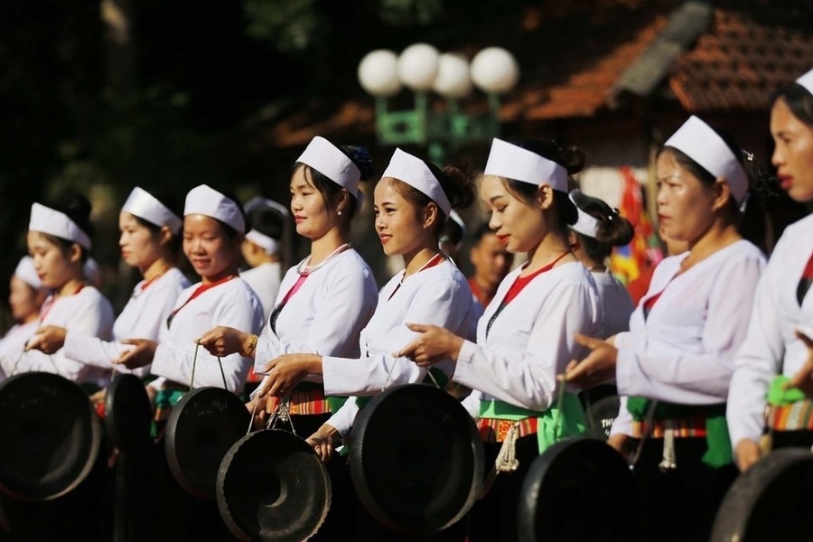 Women are responsible for playing the gong in Muong people's festivals. Photo: Vietnam News Agency