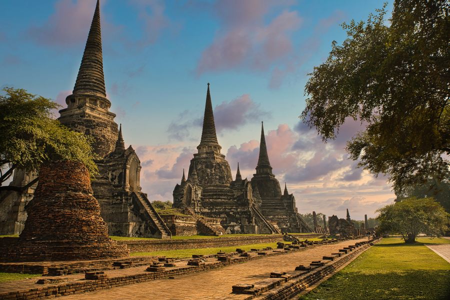 Discover the stunning ancient temples of Ayutthaya, Thailand, featuring historic architecture and serene beauty at sunset.
