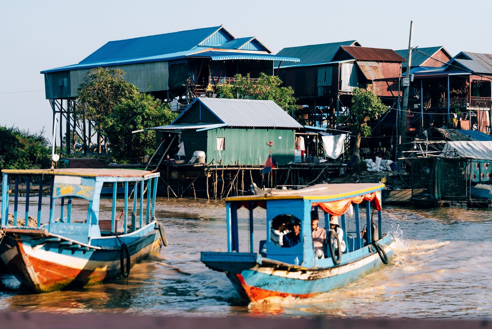 Tourists explore Tonle Sap Lake and floating villages