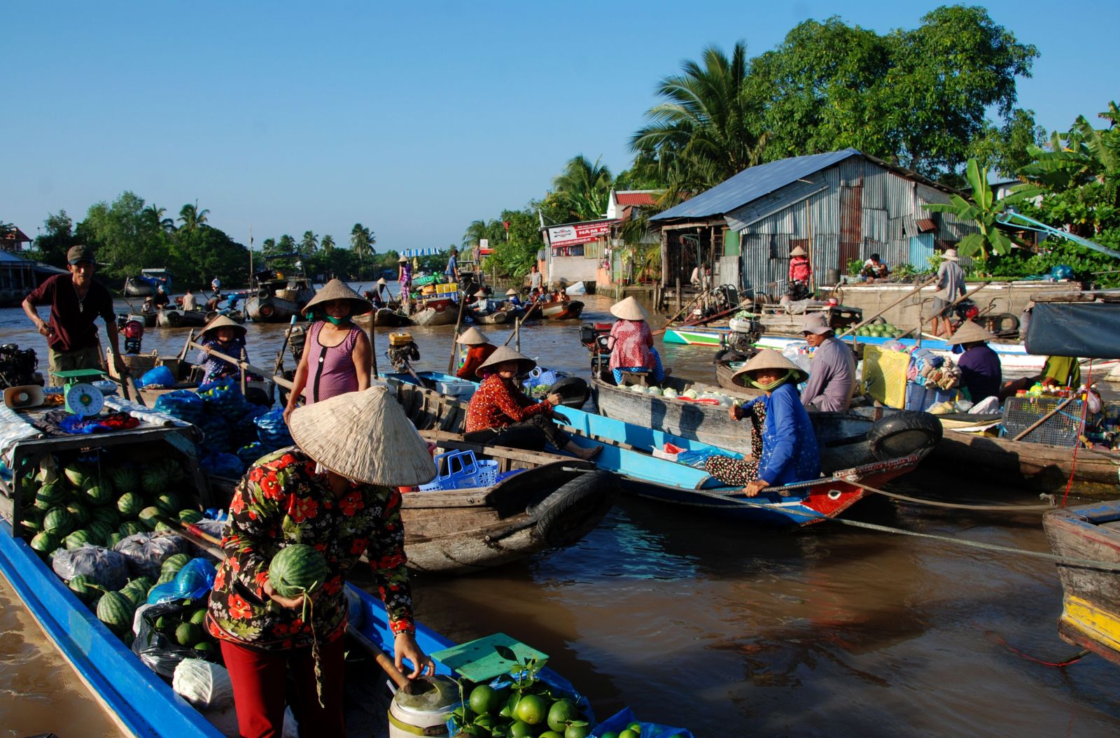 The bustling scene at a floating market in Ho Chi Minh City, Vietnam, showcases local culture and commerce.