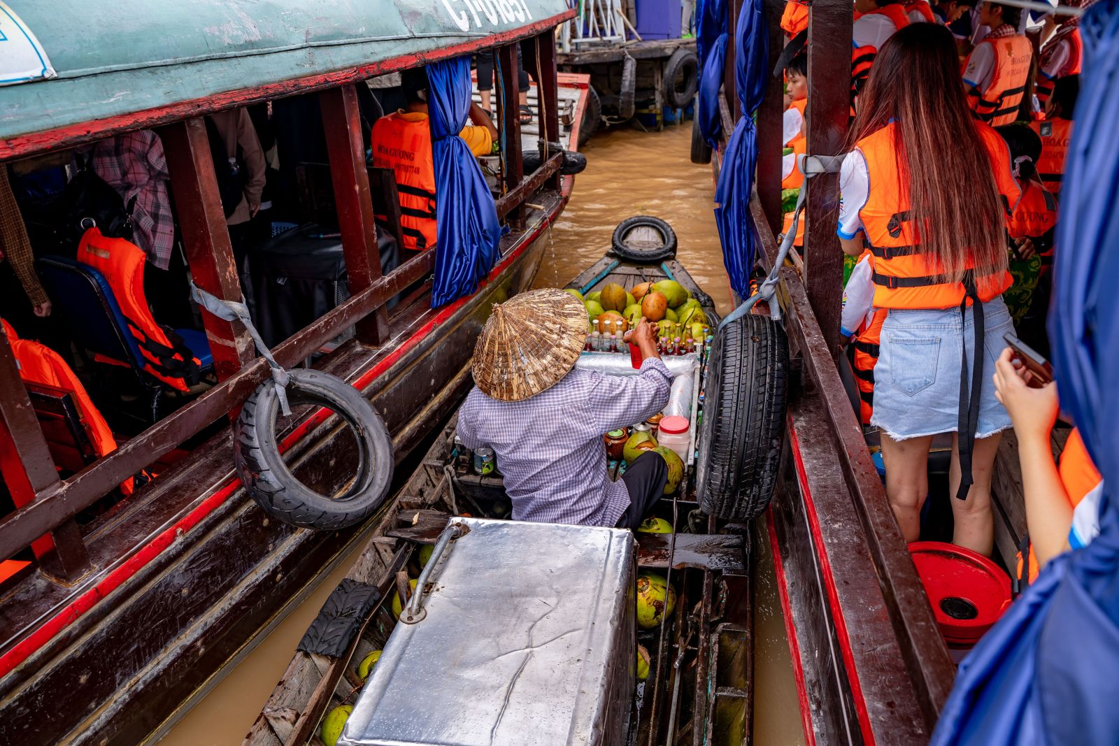 Cai Rang Floating Market is bustling with activity and vibrant colors in Can Tho, Vietnam.
