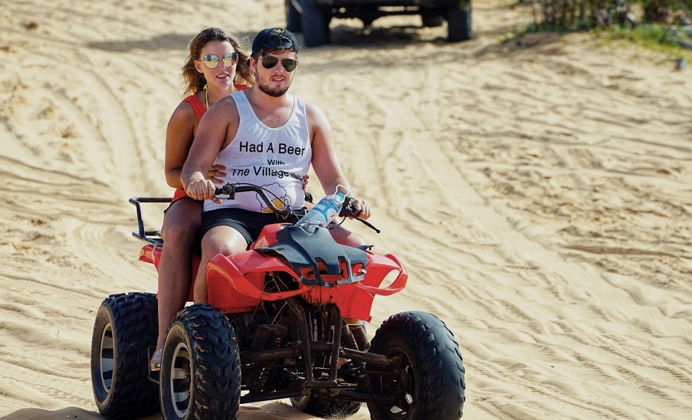 Cruising over Quang Phu sand dunes on an ATV