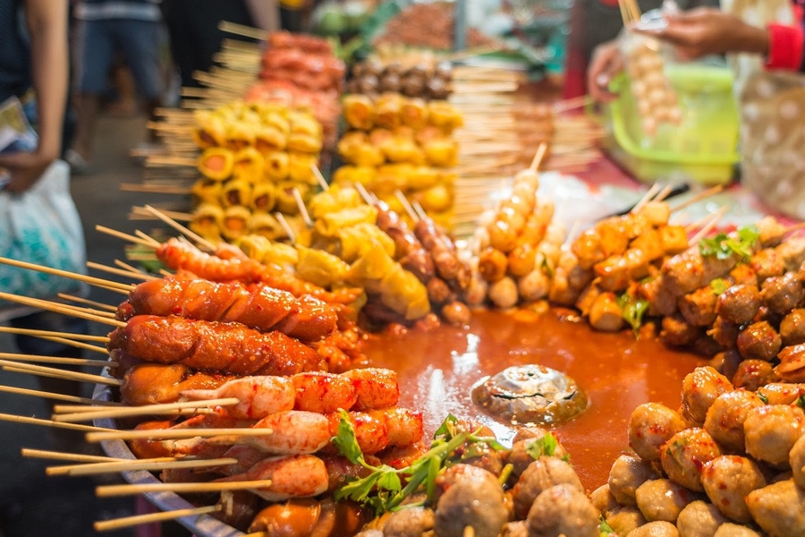 During Songkran season, you can try the street food besides the outdoor activities. Source: Vietjet Air