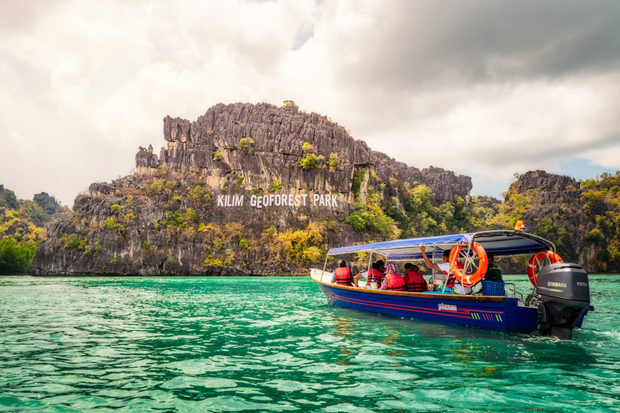 Boat ride through stunning karst cliffs