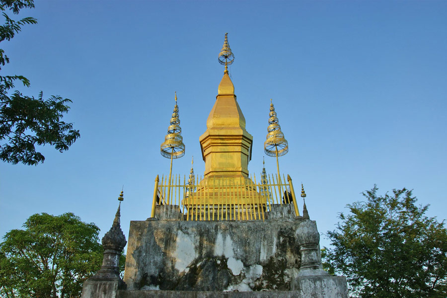 Ascend the steps of Phou Si, the sacred hill in Luang Prabang crowned with a golden stupa