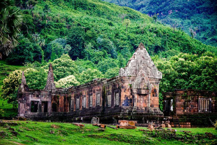 Explore the ancient Khmer ruins at Wat Phu in Champasak, a temple complex that predates the Angkor Wat in Cambodia