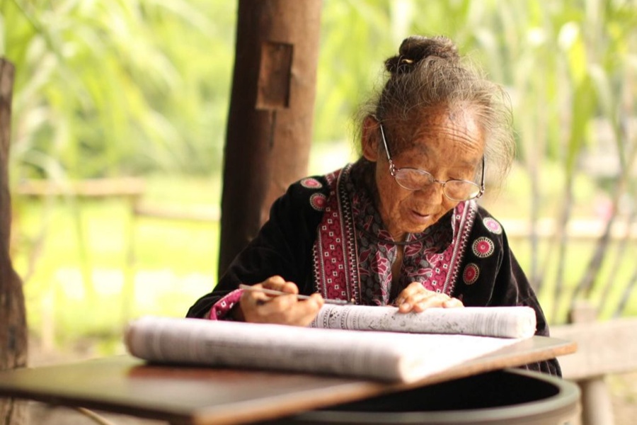 A Karen woman preserving traditional embroidery
