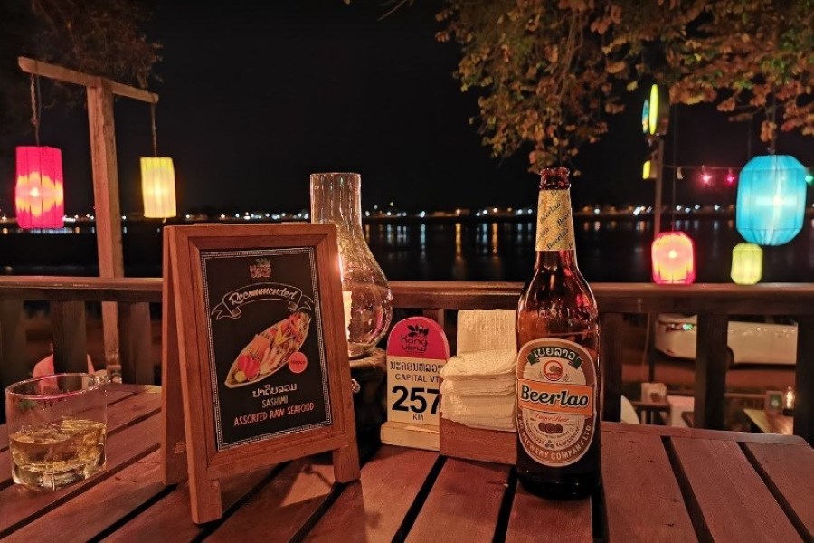 You should try Beer Laos when visiting this restaurant in Vientiane