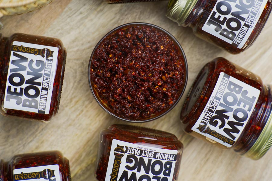 Spice up your meals with Jeow Bong, a fiery chili paste made from dried chilies, garlic, and buffalo skin