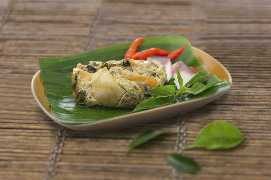 Fish Amok is a delightful dish where fish is marinated, wrapped in banana leaves, and steamed to perfection
