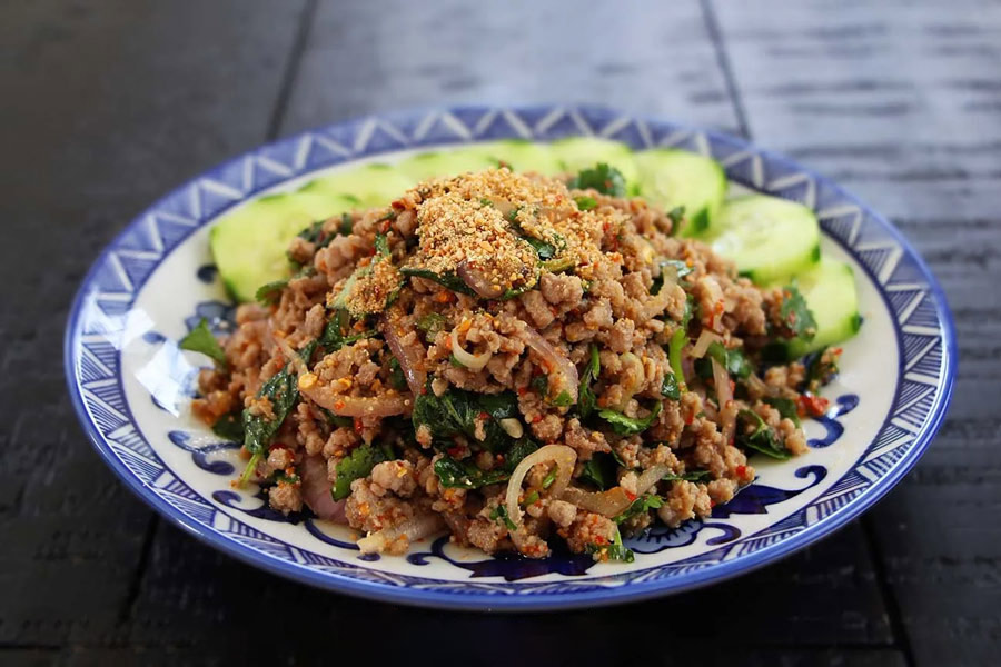 Laap is a traditional minced meat salad, typically made with chicken, beef, or fish