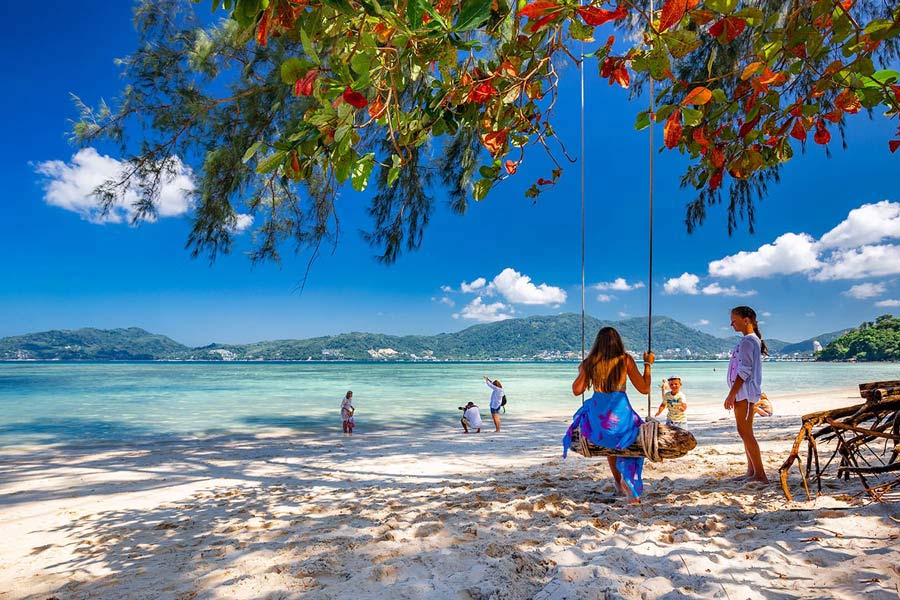 Patong Beach offers a vibrant atmosphere with a mix of water activities, nightlife, and a bustling beachfront
