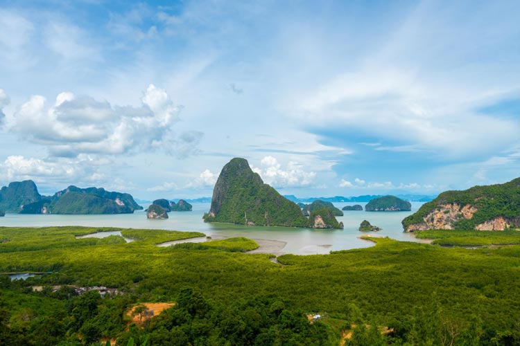 Phang Nga Bay is renowned for its stunning limestone karst formations, emerald-green waters, and picturesque landscapes