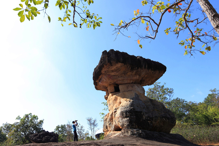 Phu Phrabat Historical Park, Udon Thani, is known for its large concentration of prehistoric rock art, ancient stone formations, and archaeological sites